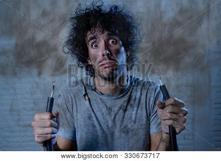 Funny Image Of Man Holding Electrical Cable After Getting Electric Shock