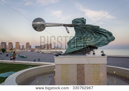 Doha,qatar- January 17, 2013: Katara Cultural Village With Statue In Foreground And The Amphitheater