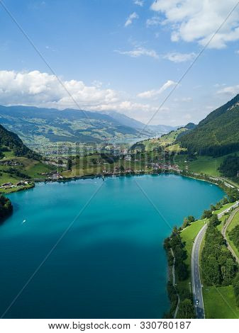 Beautiful Aerial Drone Shot View Of Lake Lungernersee In Summer Time, In Swiss Alps