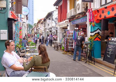 Singapore 10 Mar 2018:people Rest And Walk On Singapore Haji Lane Shopping Street