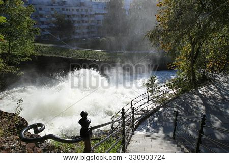 Waterfall Along The Akerselva River In Oslo, Norway.  Walking Path Along The River In City In Autumn