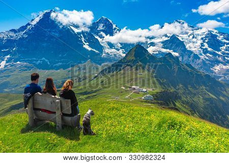 Tourists Admire Eiger, Monch And Jungfrau Mountains From Summit Of Mountain Mannlichen, Popular View