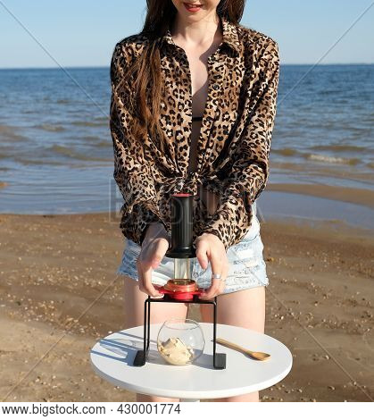 Portable Compact Manual Espresso Maker. Beautiful Barista Girl In Leopard Shirt Is Brewing Coffee An