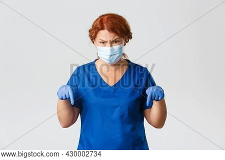 Medical Workers, Covid-19 Pandemic, Coronavirus Concept. Frustrated And Digusted Female Doctor, Nurs