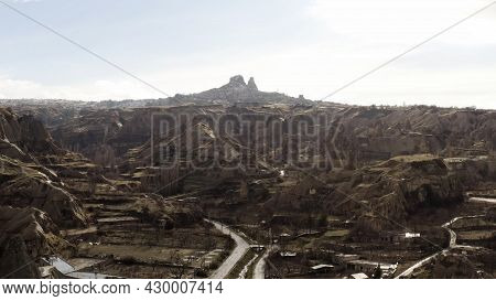 Aerial View Of Old Cappadocia Park In Turkey. Action. Stone Houses And Buildings Surrounded By Rocks