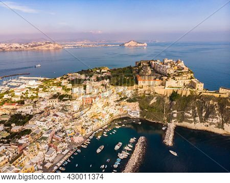 Aerial Drone View Of Italian Island Procida. Marina Corricella And Fort