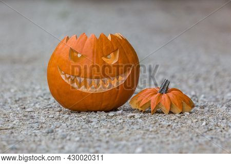 Scary Smiling Halloween Pumpkin With Nasty Face On Ground. Big Scary Smiling Halloween Pumpkin With 