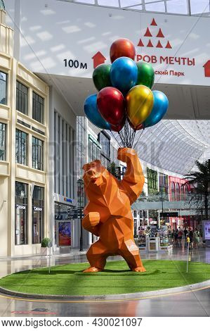 Moscow, Russia - August 15, 2021: Dream Island Amusement Park, Park Mascot - Orange Bear With Balloo
