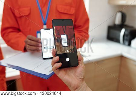 Hands Of Woman Scanning Qr Code On Smartphone That Redirects On Website For Touch Free Payment