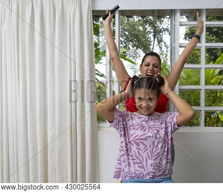 Mother And Daughter Celebrating After Hairstyle Session