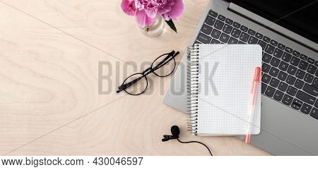 Workspace For Education.
Laptop, Microphone, Glasses, Notepad On A Wooden Table Copy Space. Banner.
