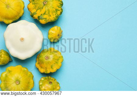 Fresh Ripe Pattypan Squashes On Light Blue Background, Flat Lay. Space For Text