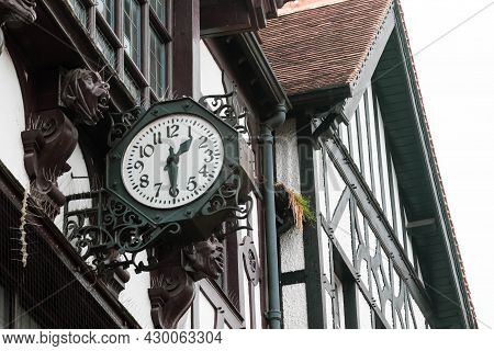 Winchester, United Kingdom, 10th August 2021:- A Clock On The Side Of A Buiding Along Winchester Hig