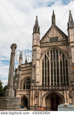 Winchester, United Kingdom, 10th August 2021:- A Stone Cross Outside The Entrance To Winchester Cath