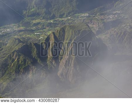 Panorama From Roche Ecrite With Effects Created By Clouds In The Impressive Steep Mountains In Reuni