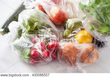 single use plastic waste issue. fruits and vegetables in plastic bags