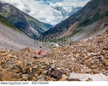 Tourist In Bikini Posing At The Chalaadi Glacier In Svaneti Region, Georgia, Caucasus.