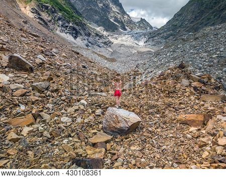 Tourist In Bikini Posing At The Chalaadi Glacier In Svaneti Region, Georgia, Caucasus.