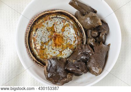 Botulism, The Danger Of Food Poisoning By Canned Food Concept.  Unsuitable Marinated Mushrooms In A 