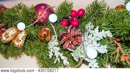 Festive Christmas Garland Background With Balloons, Cones And Electric Wires