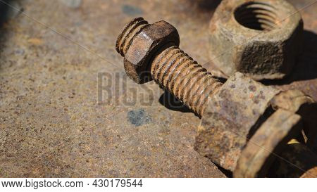 Rusty Nut. Rusty Iron Rod With Screw Threads. Rusted Mechanical Components. Threaded Bolt And Nut Is