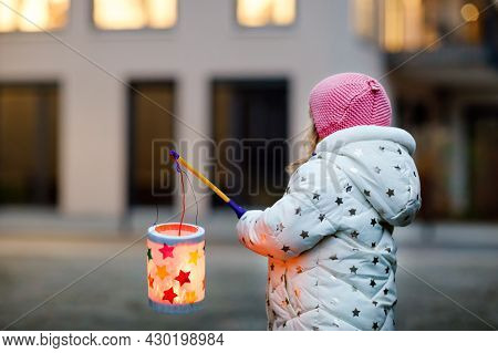 Little Kid Girl Holding Selfmade Lanterns With Candle For St. Martin Procession. Healthy Cute Toddle