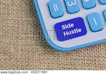 Top View Of Calculator With Text Side Hustle