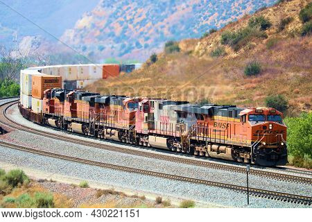 August 17, 2021 In Cajon Junction, Ca:  Railroad Locomotives Pulling Rail Cars With Merchandise Take