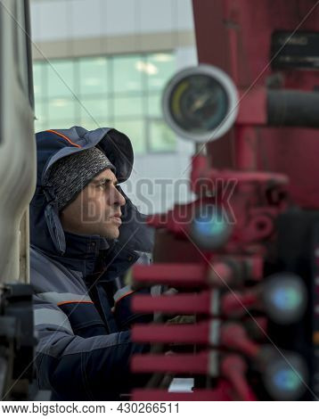 Portrait Of A Hydraulic Crane Operating Worker