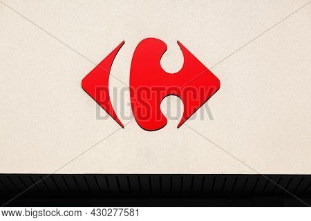 Anse, France - July 17, 2021: Carrefour Sign On A Wall. Carrefour Is A French Multinational Retailer
