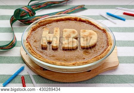 Fresh Baked Homemade Pumpkin Pie Topped With Hbd Alphabets For Birthday