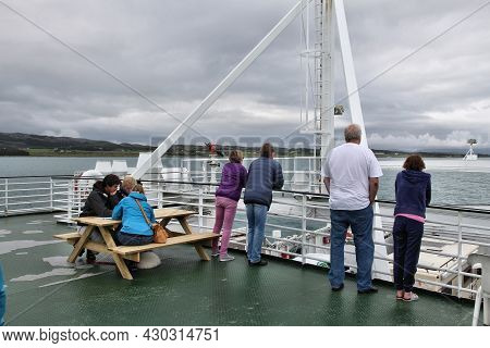 Helgeland, Norway - July 23, 2015: People Ride The Ferry Ship Across Tjottfjorden In Norway. Public 