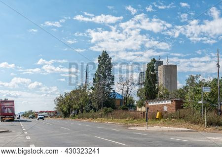 Reddersburg, South Africa - April 23, 2021: A Street Scene, With Buildings, People And Vehicles, In 