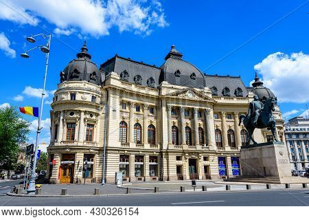 Bucharest, Romania, 6 May 2021: The Central University Library With Equestrian Monument To King Caro