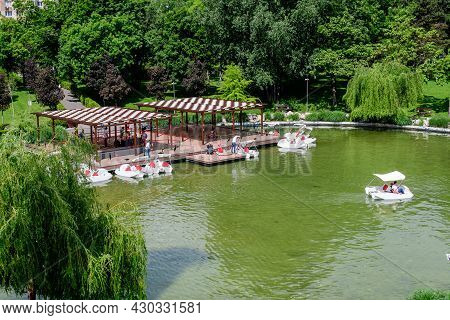 Bucharest, Romania - 29 May 2021: Landscape With Lake And Vivid Green Trees In Drumul Taberei Park (