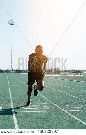 A Black Man In Sports Shorts Runs The Distance And Leads