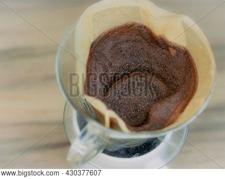 Brewing Coffee Through A Filter In A Drip Coffee Maker. Grinned Coffee In Filter Bag.