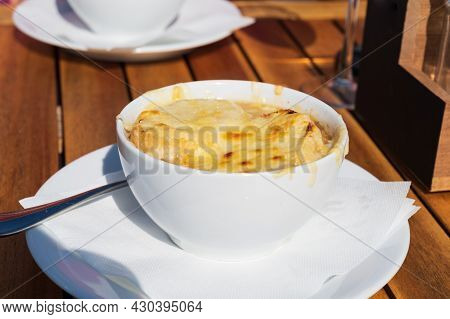 French Caramelized Onion Soup With Croutons And Gruyere Cheesse From Oven