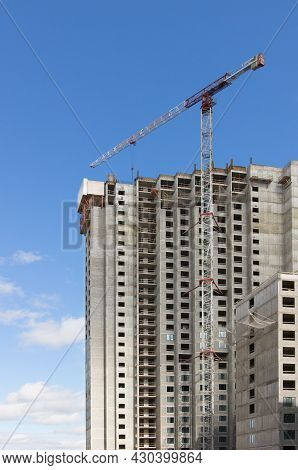 Crane Near Construction Concrete Modern Building Skyscraper.