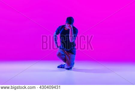 Modern Dance Style. Hip Hop, Break Dancing Dancer In Action, Motion In Dark Clothes Isolated Over Br