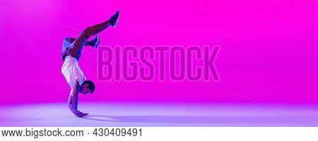 Flyer With Dancing Man, Break Dancer In Action, Motion In Modern Clothes Isolated Over Bright Magent