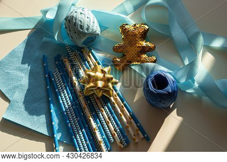 Top View Blue And Golden Colors Decor For Gender Reveal Party, Newborn Baby Shower Concept. Baby Boy