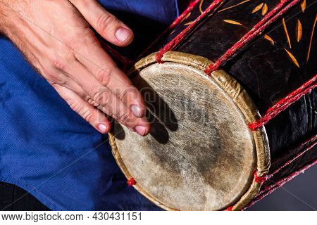 Closeup Drummer Male Hands With Jembe. Man Is Drumming On Wooden Ethnic Drum. Percussion Musical Ins