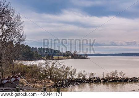 Jamestowne, Va, Usa - April 1, 2013: Historic Site. Gray Water James River Under Blue Cloudscape Wit