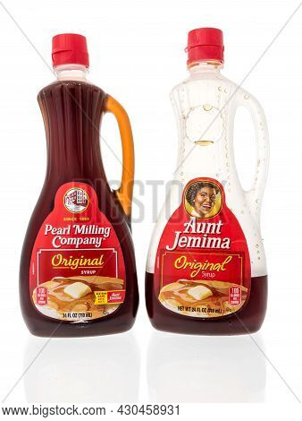 Winneconne, Wi -20 August 2021:  A Bottle Of Pearl Milling Original And Aunt Jemima Syrup On An Isol