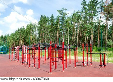 Outdoor Sports Ground With Outdoor Exercise Equipment In The Forest.