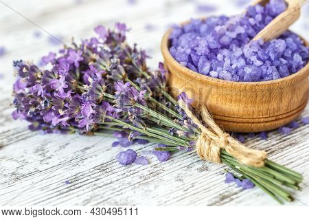 Lavender's Spa Products With Dried Lavender Flowers On A Wooden Table. Flat Lay Bath Salt And Massag