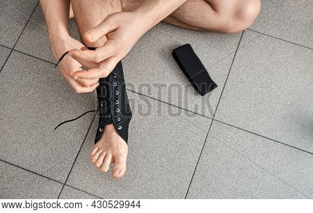 The Male Leg Is Fixed In A Medical Bandage. Ankle Fracture Or Sprain. Lacing And Tight Fit Of The Fo