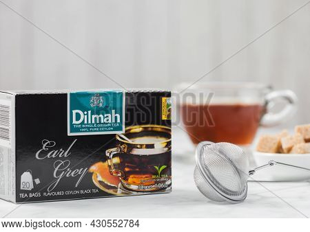 London, Uk - October 21, 2020: Box Of Dilmah Earl Grey Tea With Glass Cup And Strainer Infuser On Wh