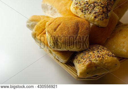 Various Types Of Bread Served On A Wicker Tray, Delicious And Fresh Rolls